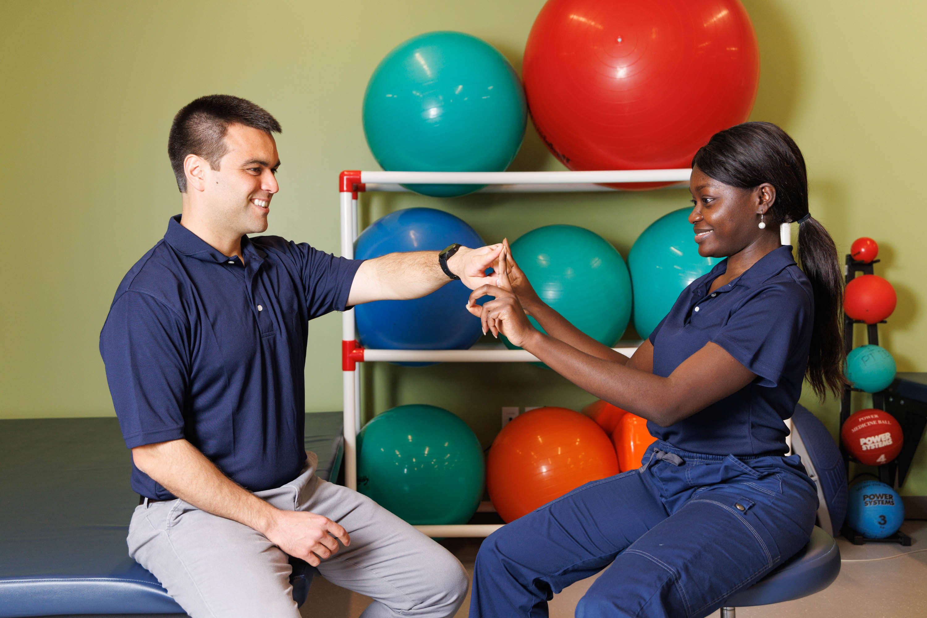 Physical therapy students working together in a clinical setting