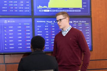 Students learning in Mercy trading room