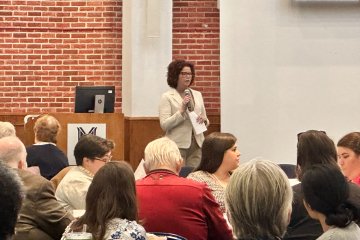 Provost and Senior Vice President of Academic Affairs Kristin Curry Greenwood addresses audience at Spring Faculty Seminar Day