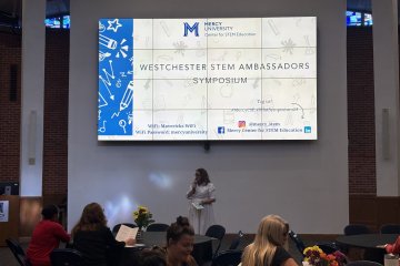 Dr. Meghan Marrero addresses the audience at the Westchester STEM Ambassadors Symposium