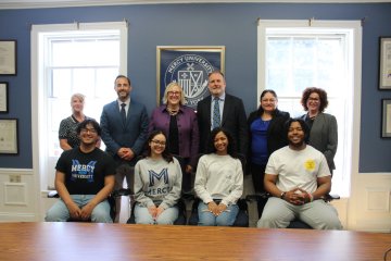 Mercy University and Cristo Rey Network officials along with students