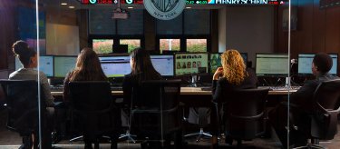 Students learning in the Mercy trading room