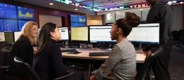 business students in the trading room