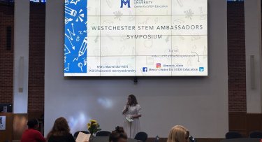 Dr. Meghan Marrero addresses the audience at the Westchester STEM Ambassadors Symposium