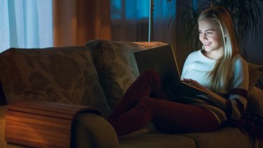 working on a laptop at night.