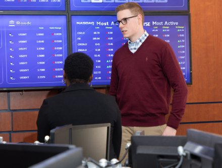Business students in trading room