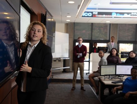 Students learning in Mercy trading room