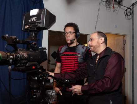 A teaching moment in Mercy's TV and Radio Production studios.
