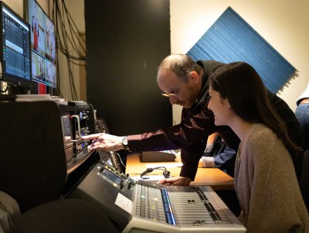 In the control room of a television production.