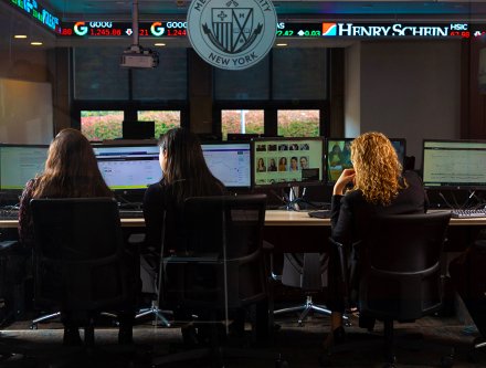 Students learning in the Mercy trading room