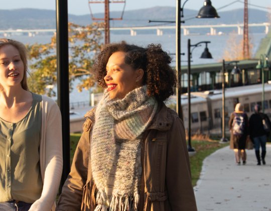 Diverse students walking to campus together.
