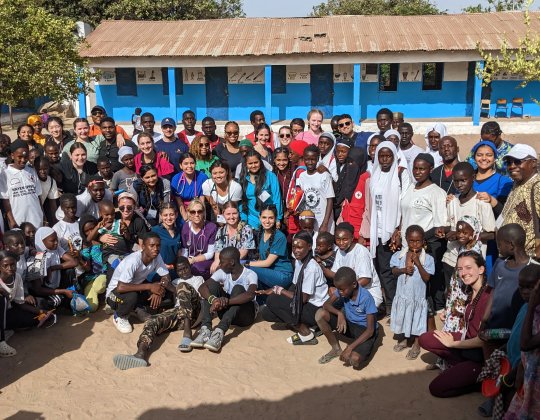 Photo of group of patients and Mercy students and faculty