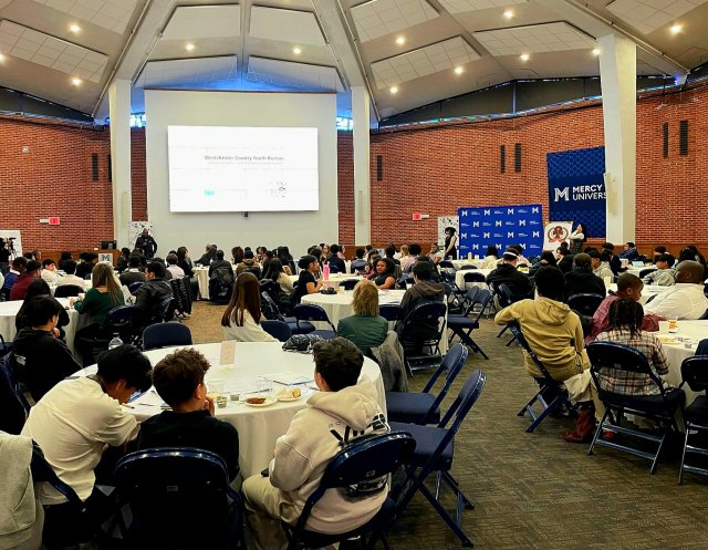 Participants at 2025 MedTech & Finance Conference in the rotunda at Mercy University